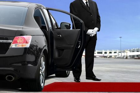 Private driver opening car door 