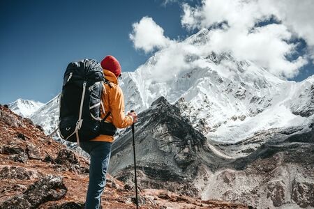 Man climbing up a mountain
